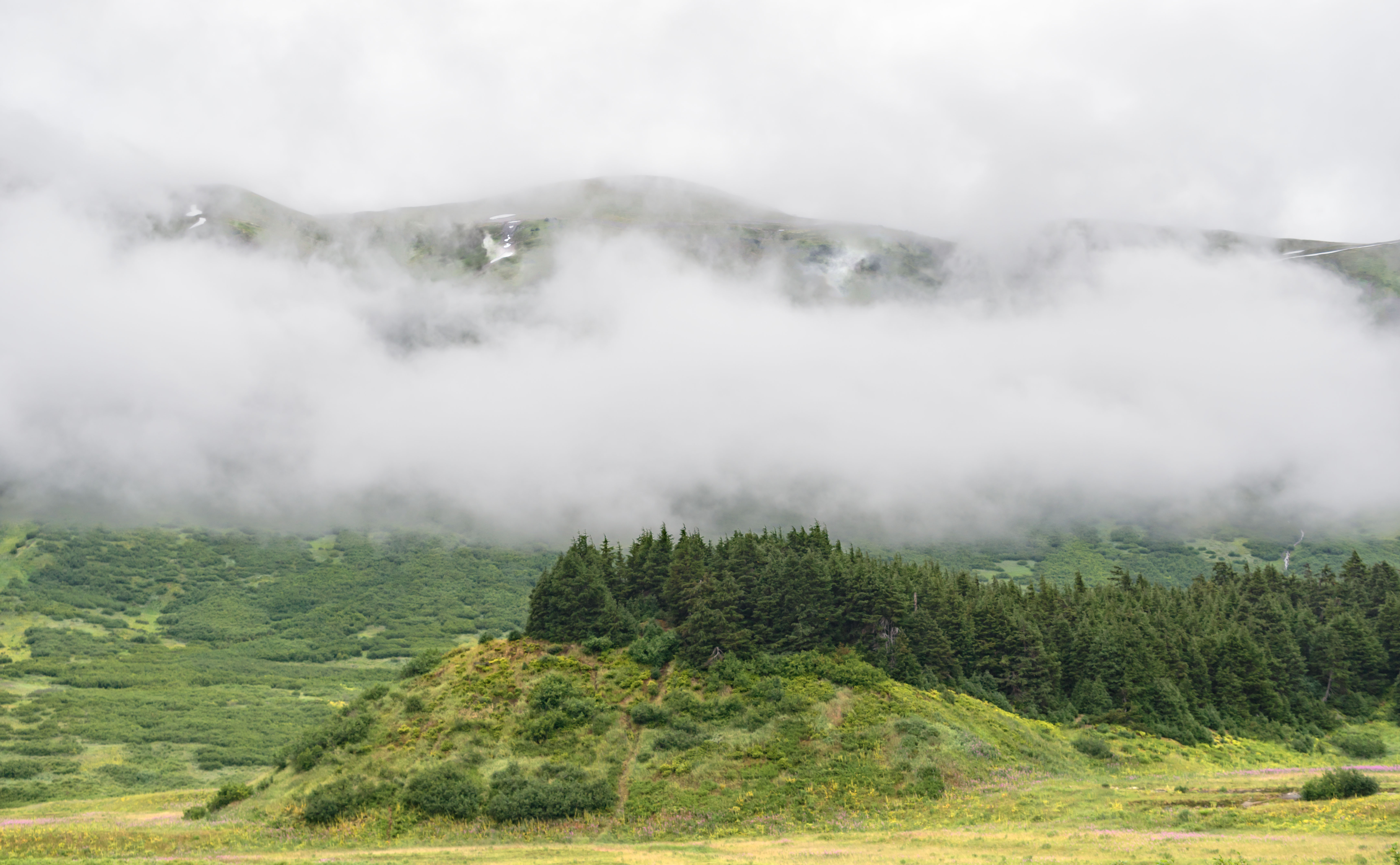 Low clouds hug the mountans in Turnagain Pass on the Kenai Pennsulia, Alaska