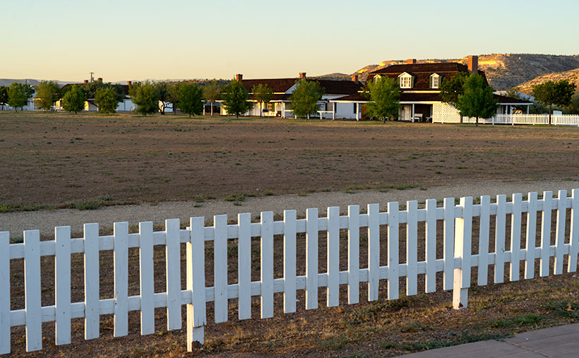 The parade grounds at Camp Verde are surrounded by a picket fence and they are the commanding officer's back yard.