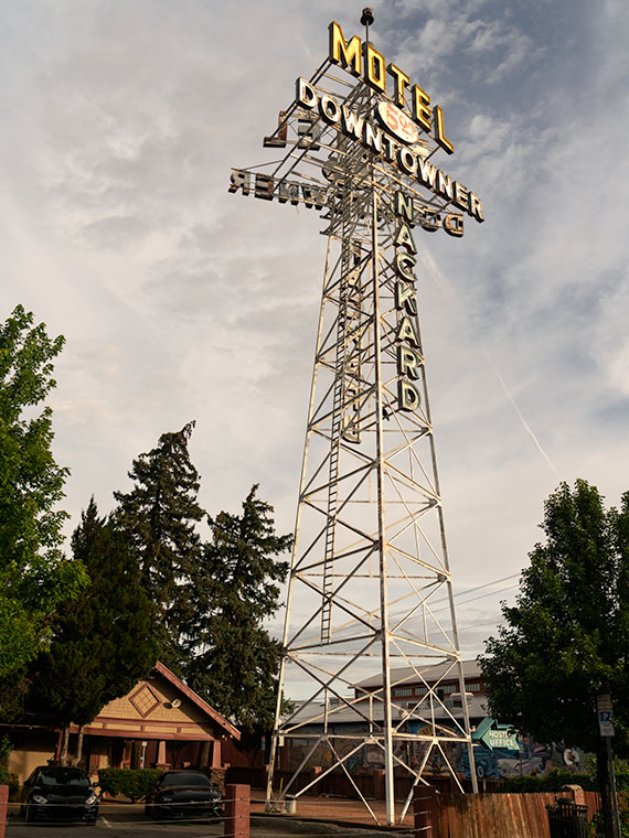 On the south side of Flagstaff's railroad tracks is the tall tower sign for the Motel Downtowner.