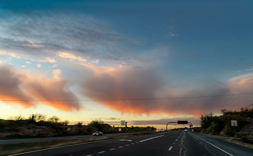 Pink Virga—On the drive home a line of low clouds turned pink with streaks of virga emanating from them. Of course, all I could do is snap a photo through the windshield.