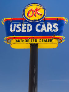 OK Used Cars antique sign.