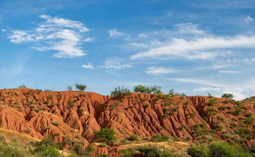 Mine Tailings - Tailings comprised of red soil caught my eye because of the color and erosion pattern.