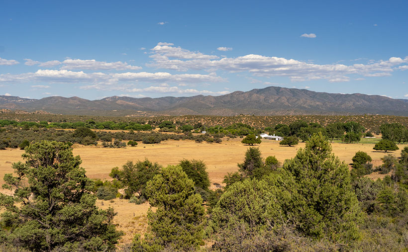 Ferguson Valley - Against a backdrop of the Sierra Prieta range, a white ranch-house sits in pretty Ferguson Valley. 