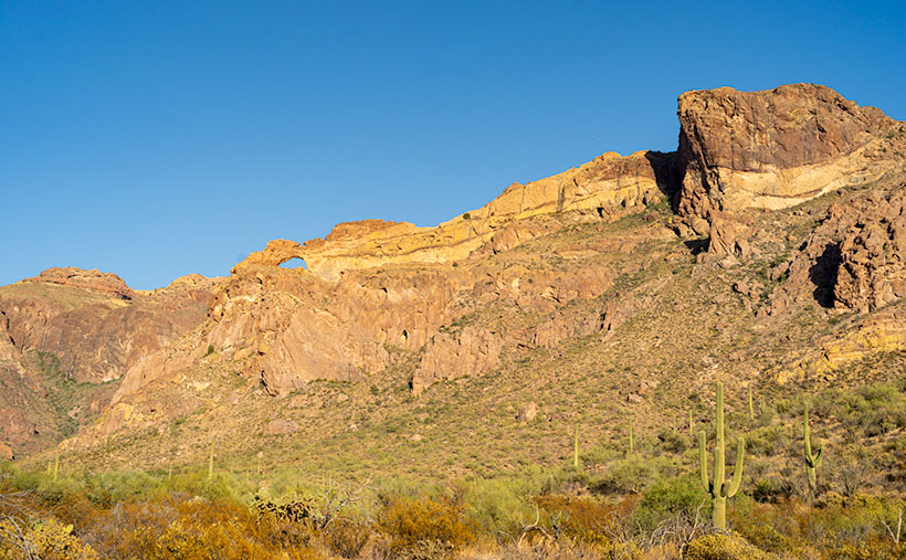 Arch Canyon - At the north end of the Ajo Mountain Loop, you'll find the picnic grounds at Arch Canyon with an unnamed arch overlooking the area.