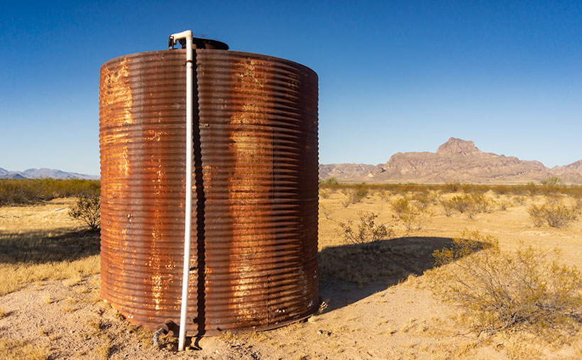 On the plains south of Big Horn Mountain Wilderness Area, is a rusty tank meant to provide water to cattle on the open range.