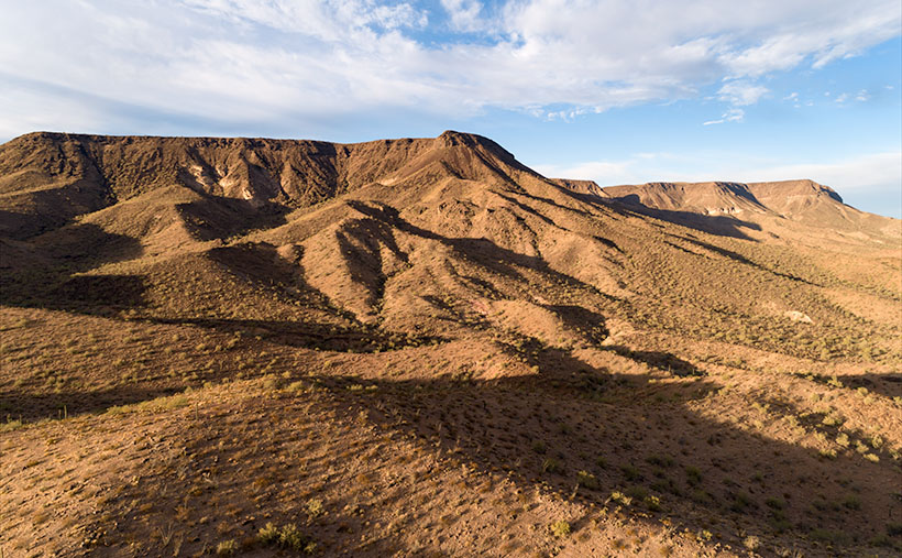 New Water Black Mesa - The early morning sun highlights the cliffs of Black Mesa overlooking Interstate 10 in western Arizona.