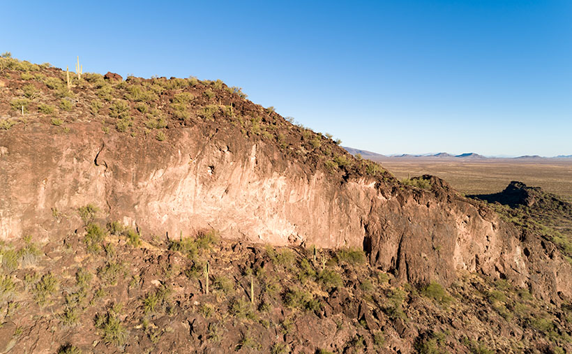 Eagle Eye Cliff - The cliffs on the south side of the Eagle Eye Mountains shows that there is limestone foundations under the lava.