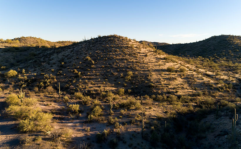 Evening in the Hills - The low evening sun throws long shadows on the desert.