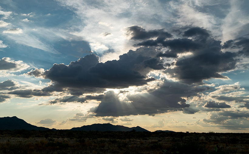 Sun Rays - Light beams radiate from clouds near Hillside, Arizona.
