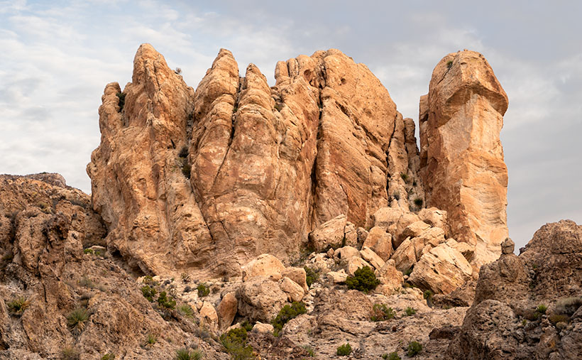 Broken Crown - A crown of tuff rests on a layer of basalt in Union Pass.