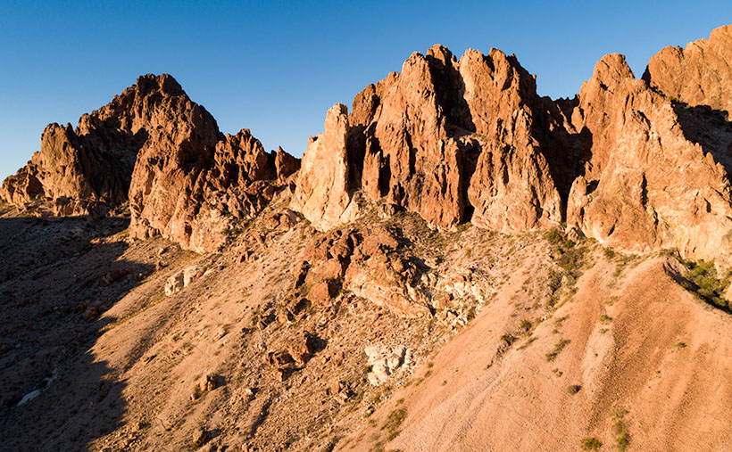 Sunset Wall - Layers of volcanic rock upended vertically in the Black Mountain Range.