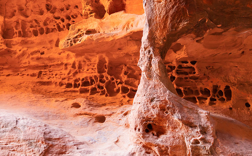 Arch and Honeycomb Weathering - inside the cave on the Jenny's Canyon Trail are a natural window and Honeycomb Weathering.