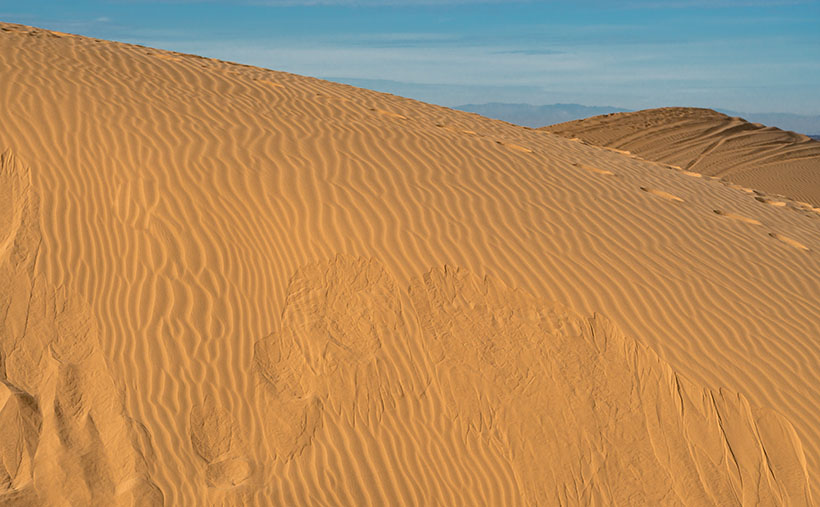 Dune Avalanche - When the angle of wind-blown sand meets or exceeds 35 degrees, the sand collapses under its own weight and slides down the dune's leeward face.