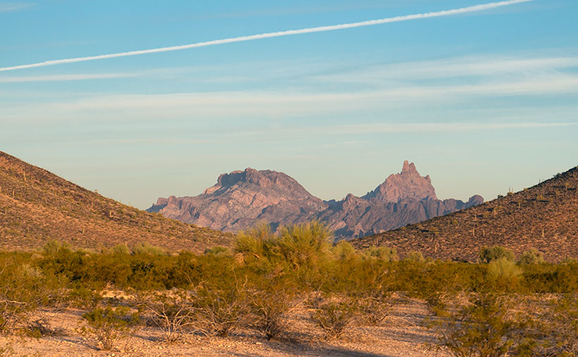 Framed between two of the Cemetery Ridge Mountains, Eagletail Peak's feathers lit by the sunrise.