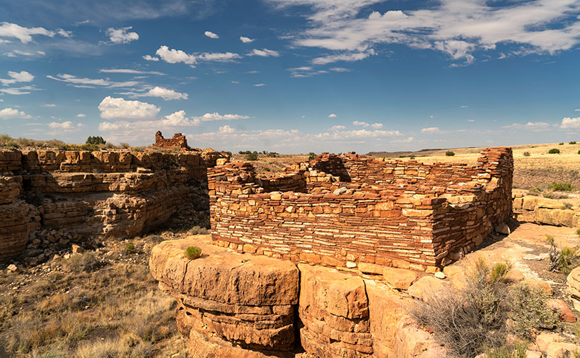 A pair of Pueblo ruins adorn the cliff tops on either side of Box Canyon in Wupatki National Monument.