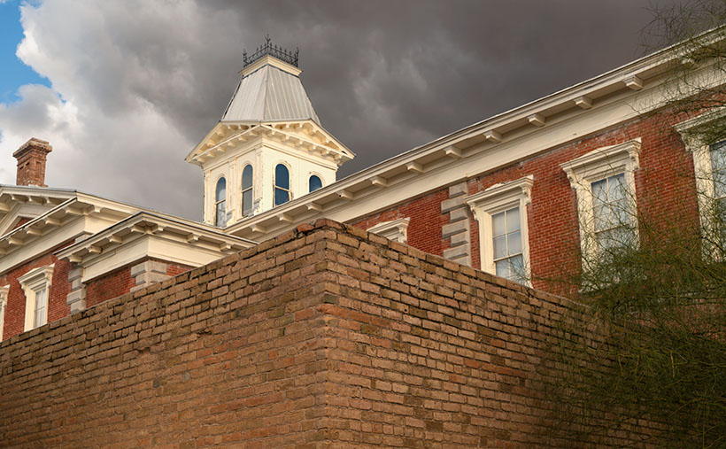 Courthouse Yard - The tall brick wall surrounding the Tombstone Courthouse yard conceal the gallows within them