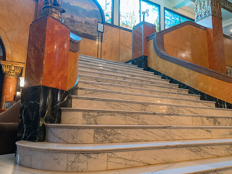 Marble Memories - Immerse yourself in the timeless elegance of the Gadsden Hotel's grand marble staircase, inviting you to step into a world of architectural splendor.