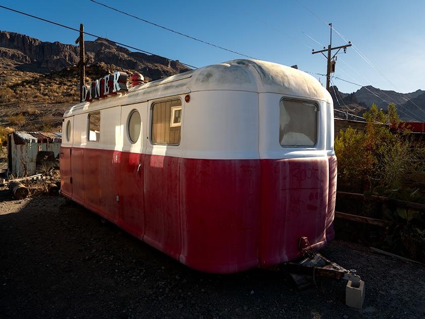 Vintage red and white diner trailer tucked away in an alley of Oatman, Arizona, along historic Route 66.