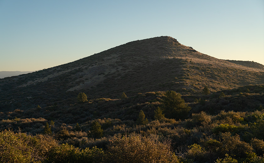 Early morning light casting a chilly haze over the hills above Peeples Valley, Arizona