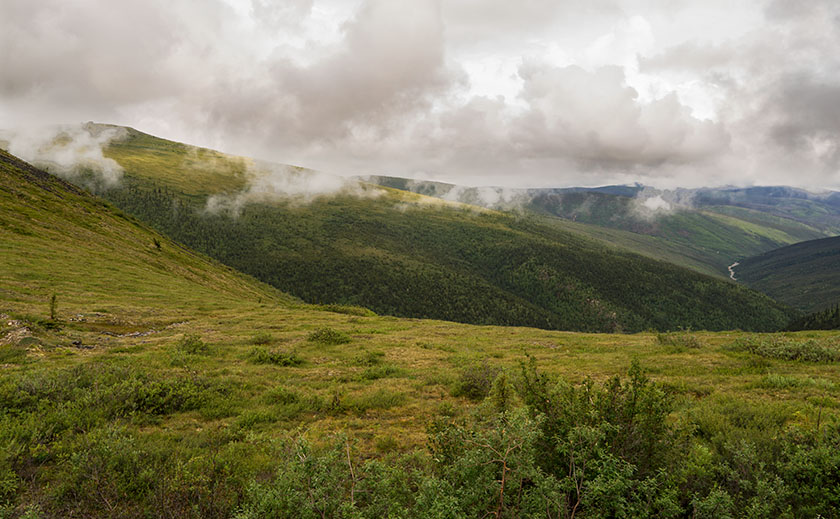 Clouds kiss the mountain tops along the Top Of The World Highway in Canada's Yukon Territories.