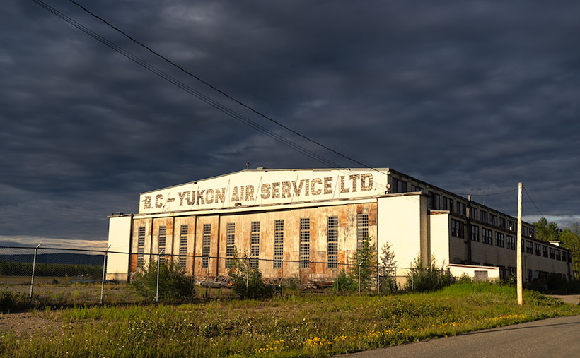 Dark stom clouds threaten rain until the sun fines a break and lights up the Watson Lake Airport.