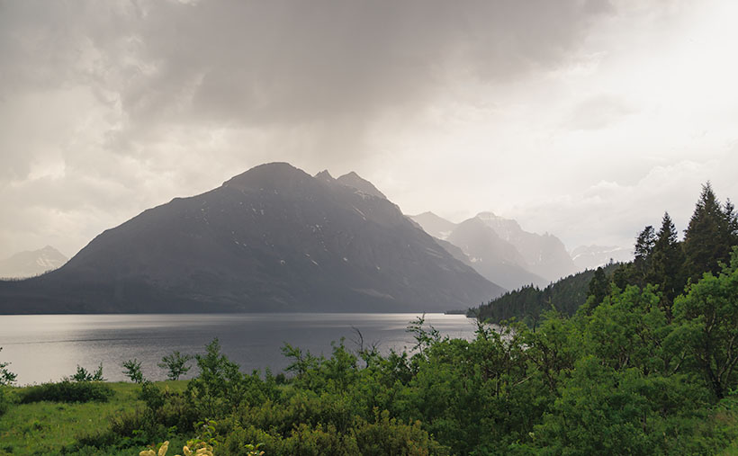 A summer shower over Lake Saint Mary and the Rockies in Glacier Nationnal Park