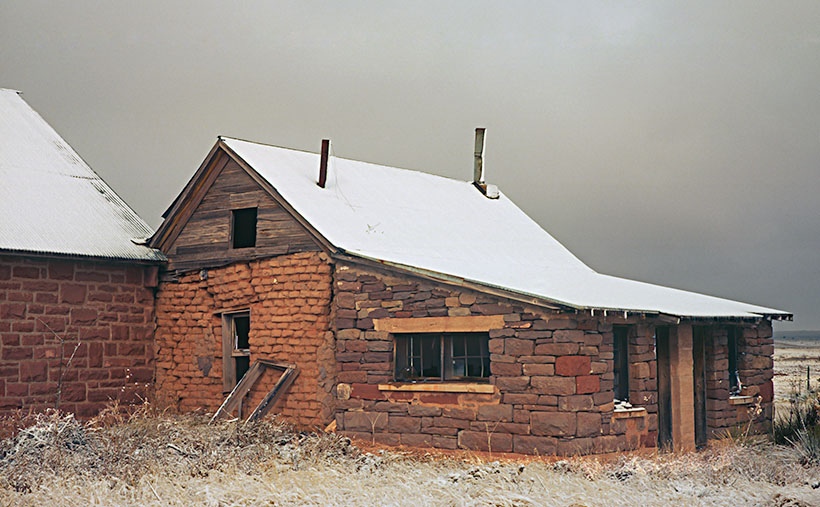 After a night of snow, the shack behind the Curevo, New Mexico Church almost looks like a warm place to stay.