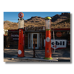 Two antique gas pumps in Oatman bring back memories of cheap times.