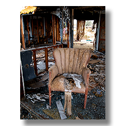A brown side chair found in a flood damaged trailer home phtotographed by Jime Witkowski.