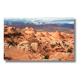 A winter storm begins to break up behind hoodoos near Page Arizona.